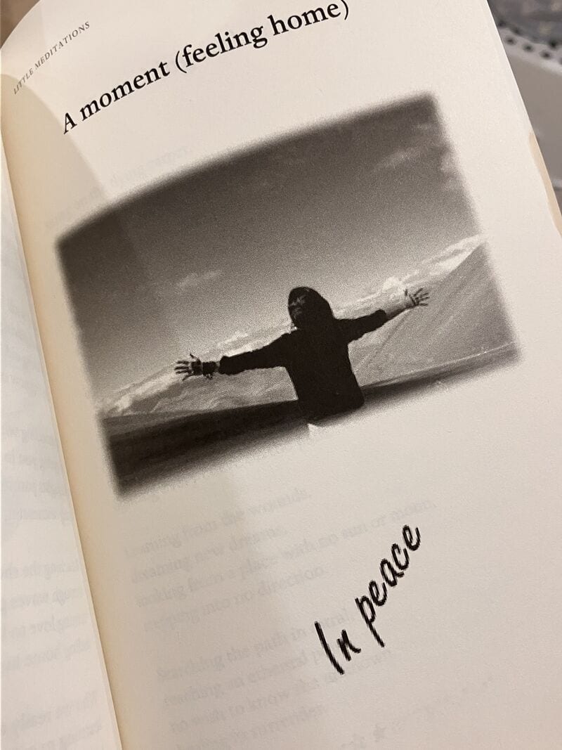 A page from Little Meditations — a figure with arms open beneath the words 'A moment (feeling home)' and 'In peace'